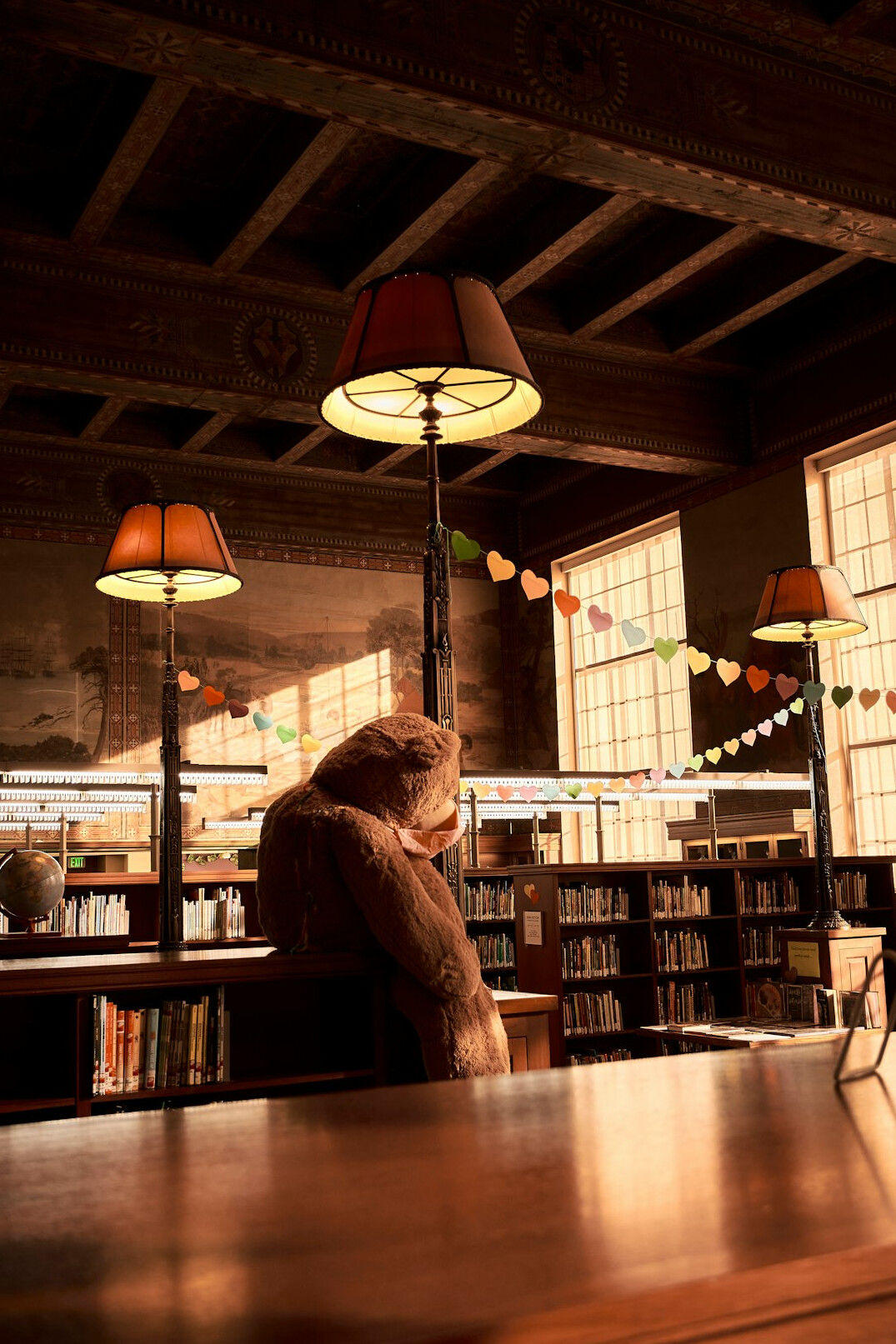 Woman reading on a tablet in a quiet library