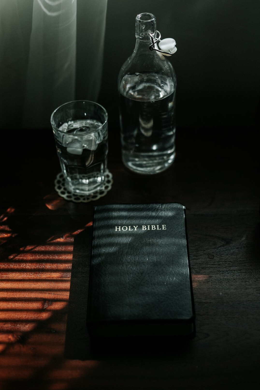Open book notebook and coffee cup on a wooden desk seen from above